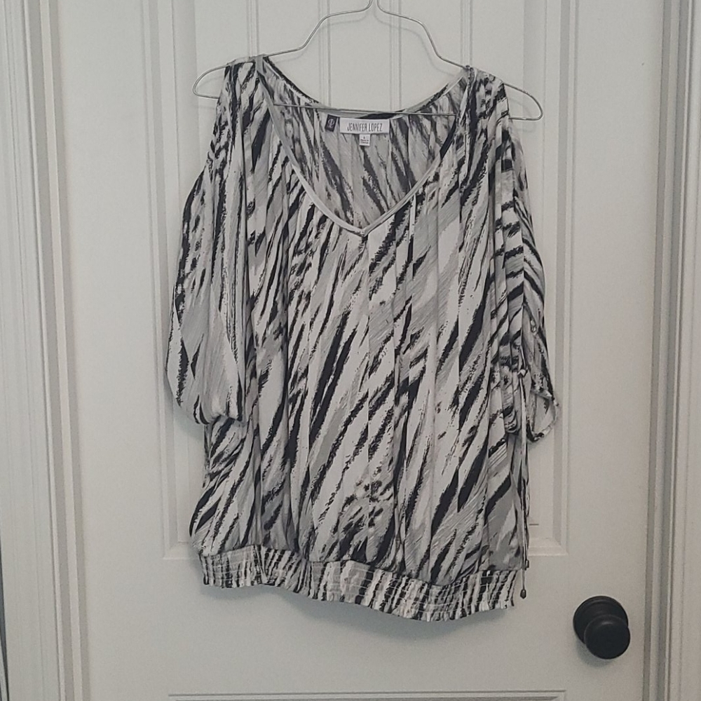 Jennifer Lopez peek a boo shoulder blouse